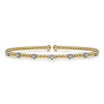 14K YELLOW AND WHITE GOLD .21CTW DIAMOND STATION BUJUKAN CUFF BRACELET