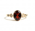 14K YELLOW GOLD DIAMOND AND OVAL GARNET RING