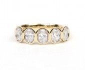 14K YELLOW GOLD OVAL DIAMOND BEZEL SET BAND