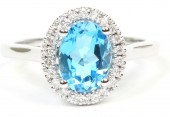 14K White Gold .15Ctw Diamond 1.45Ct Oval Blue Topaz  Ring