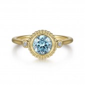 14K YELLOW GOLD .03CTW DIAMOND AND .92CT BLUE TOPAZ RING