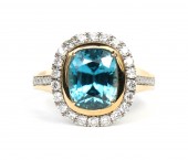 14K TWO TONE DIAMOND & BLUE ZIRCON RING