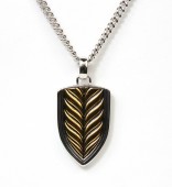 STERLING SILVER AND GOLD PLATED SHIELD PENDANT ON A CURB CHAIN